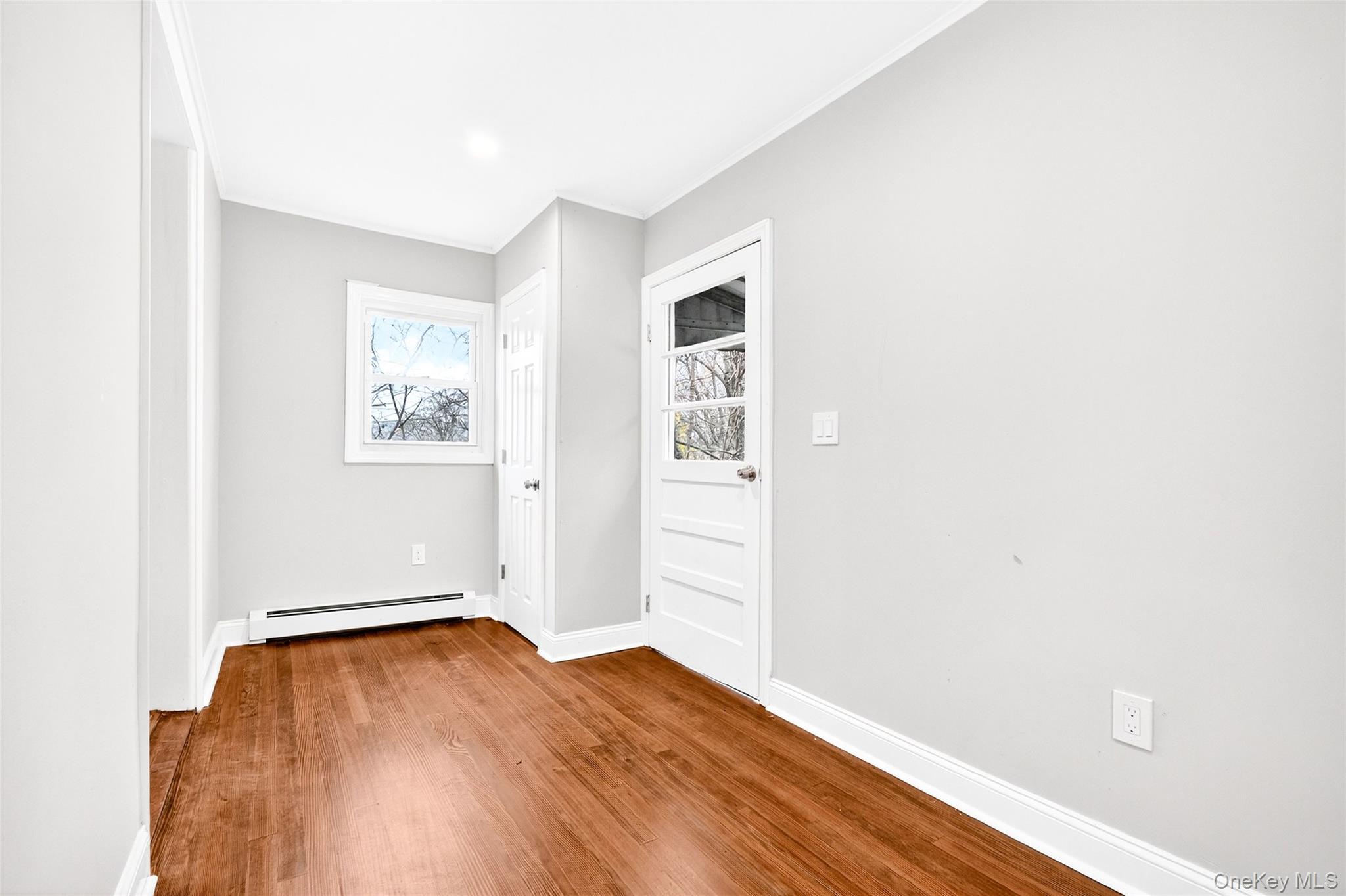 669 North Division Street Peekskill, NY 10566 - Photo 11 of 48 an empty room with wooden floor and closet