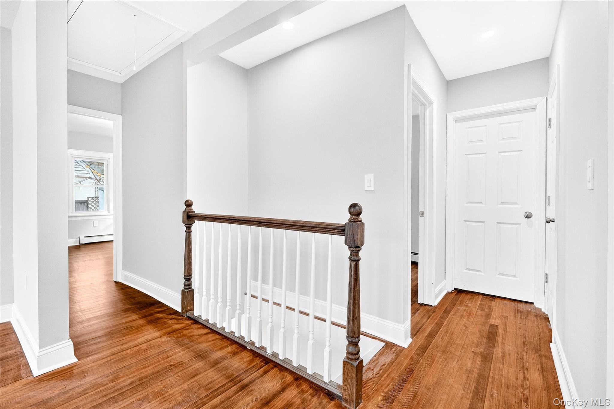 669 North Division Street Peekskill, NY 10566 - Photo 15 of 48 a view of a hallway with wooden floor and staircase
