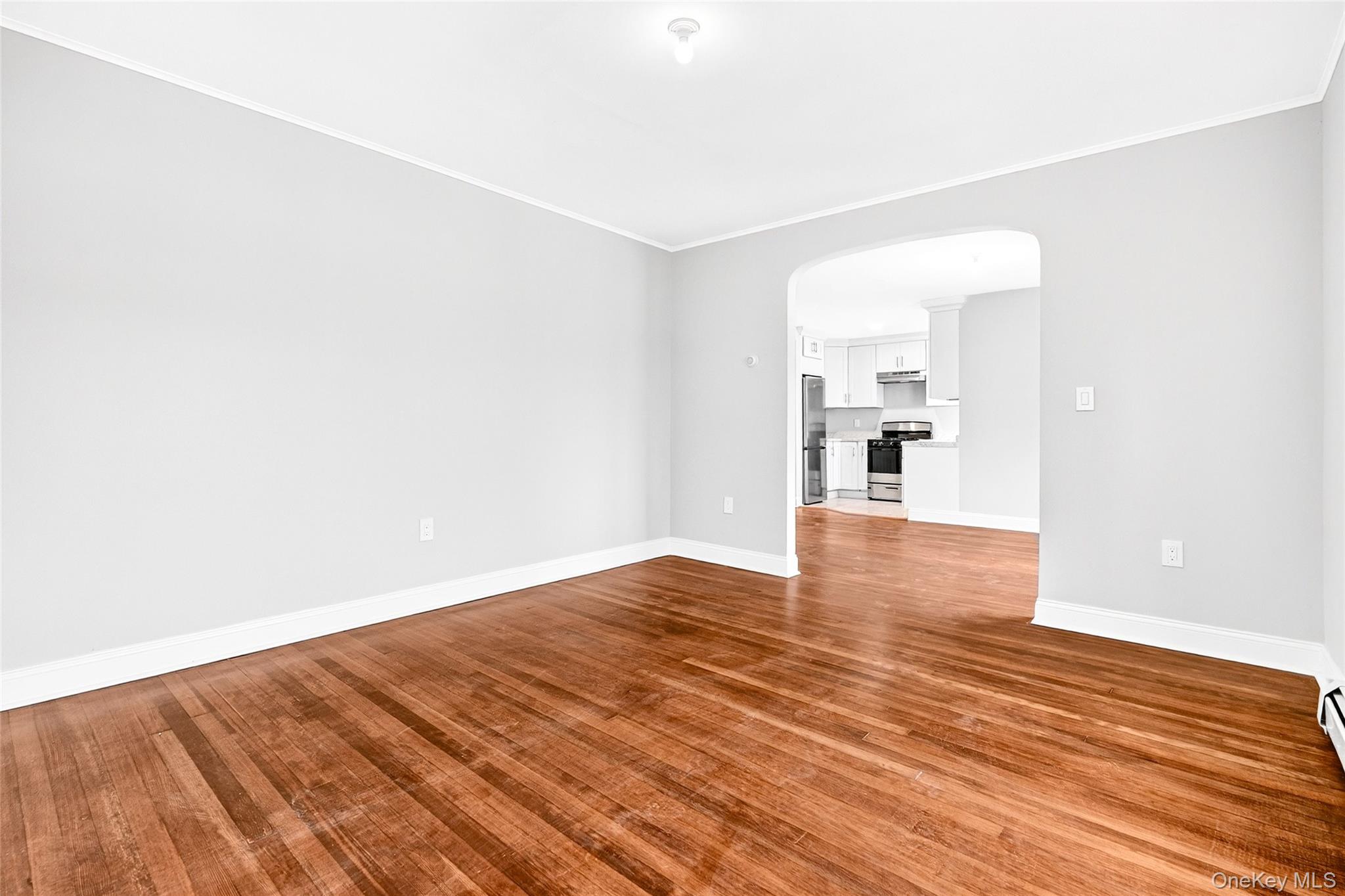 669 North Division Street Peekskill, NY 10566 - Photo 16 of 48 a view of empty room with wooden floor