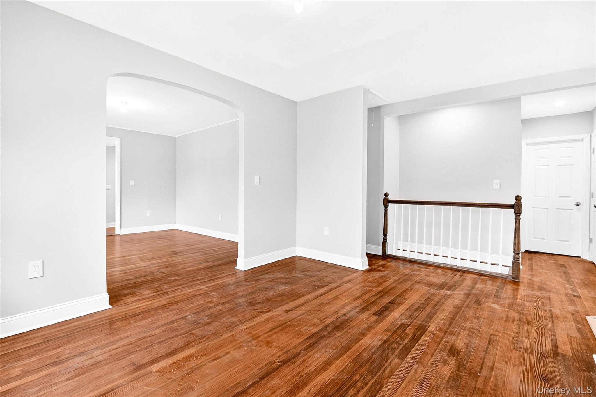 669 North Division Street Peekskill, NY 10566 - Photo 19 of 48 an empty room with wooden floor and windows