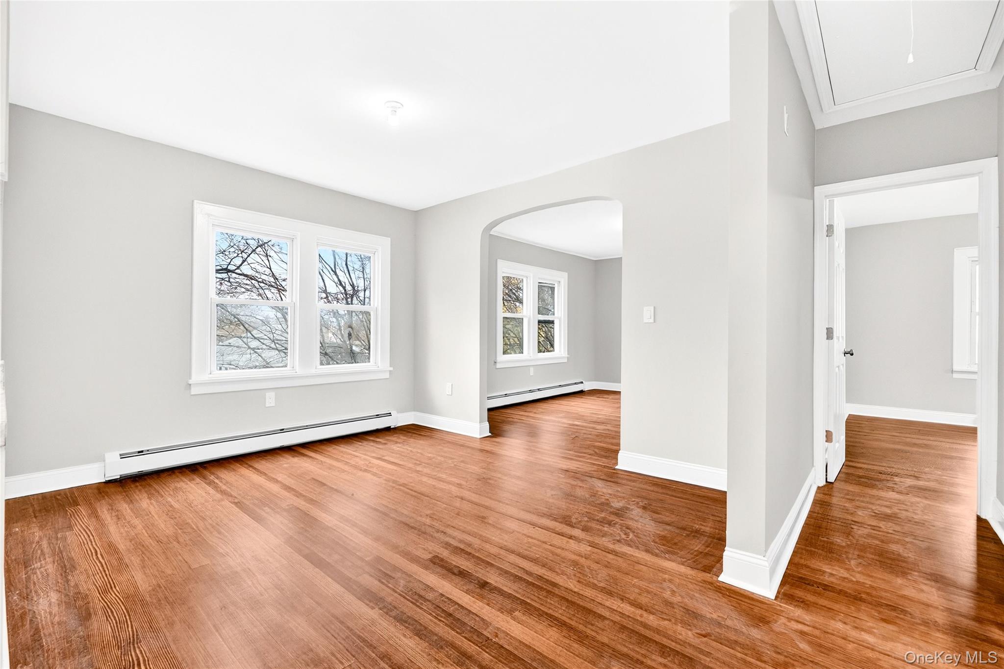 669 North Division Street Peekskill, NY 10566 - Photo 22 of 48 an empty room with wooden floor and windows