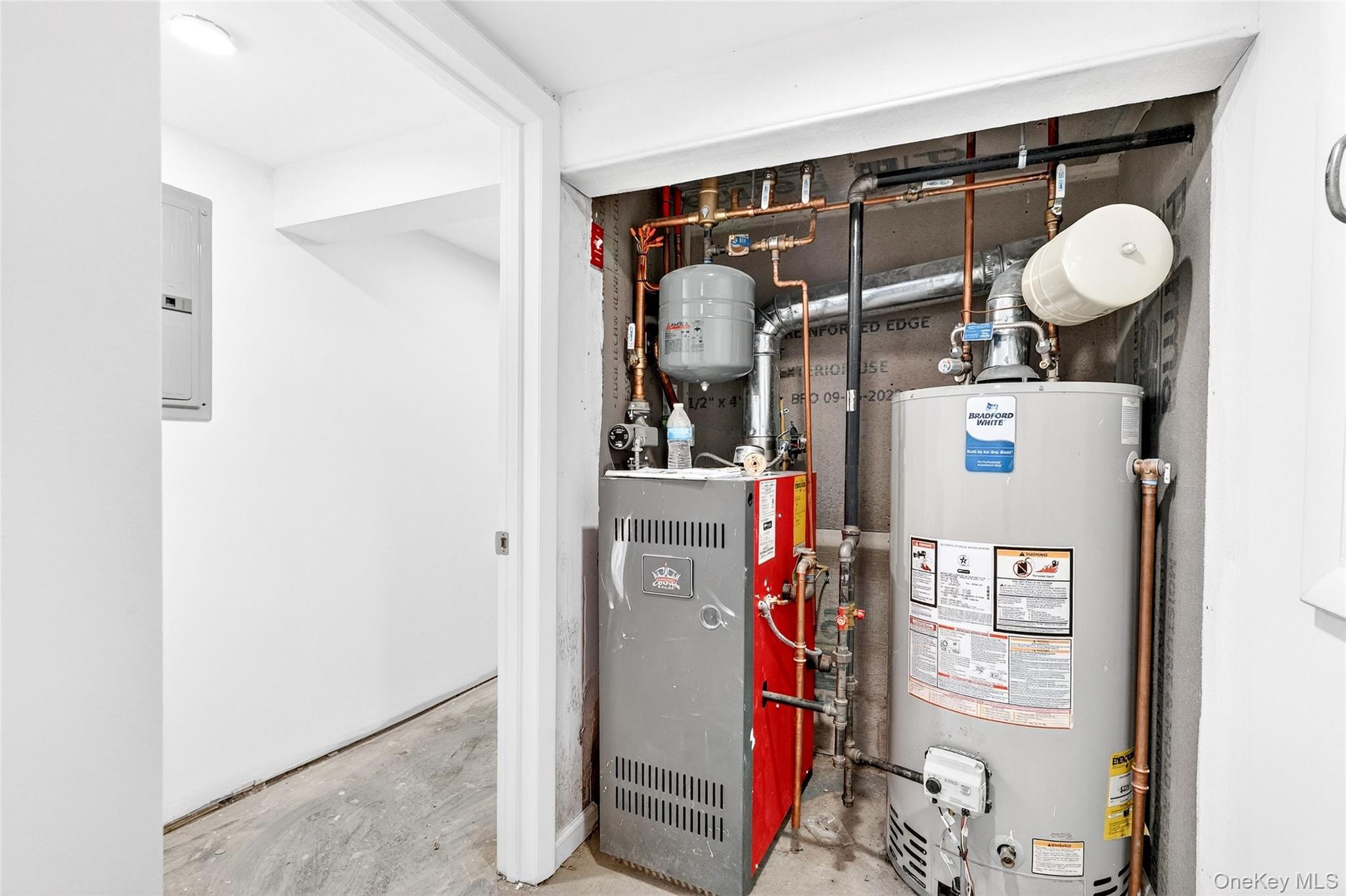 669 North Division Street Peekskill, NY 10566 - Photo 40 of 48 a view of storage and utility room with washer and dryer