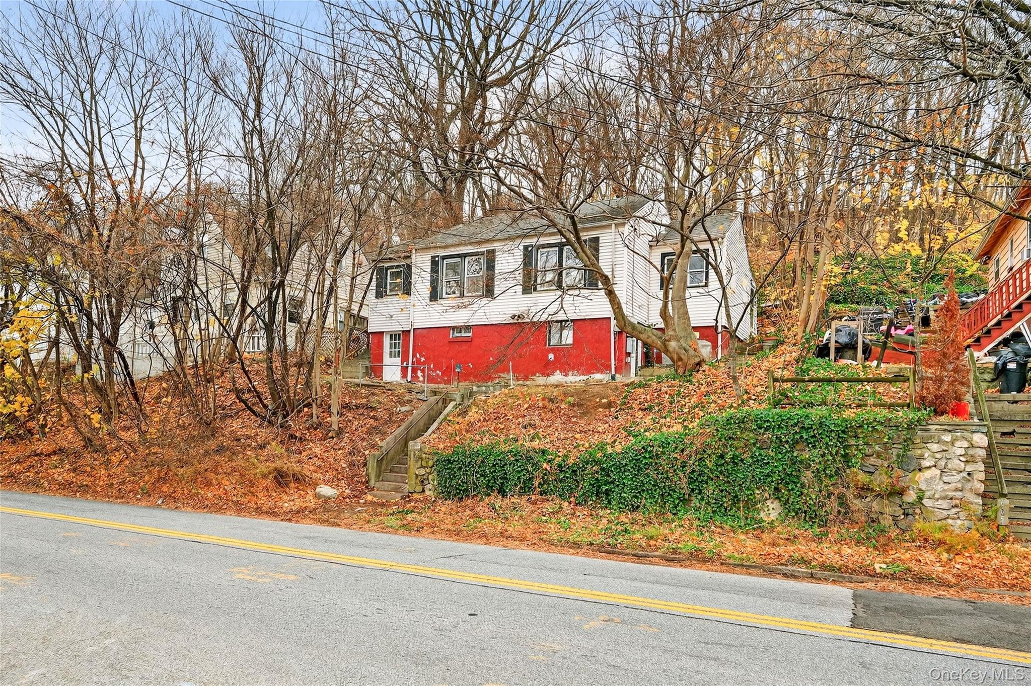669 North Division Street Peekskill, NY 10566 - Photo 41 of 48 a front view of a house with a yard and garage
