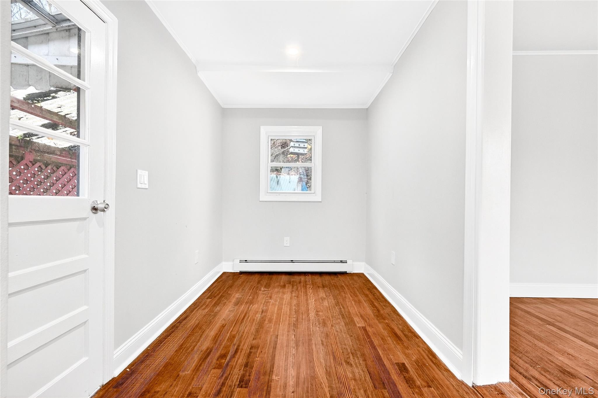 669 North Division Street Peekskill, NY 10566 - Photo 9 of 48 a view of a hallway with wooden floor and entryway