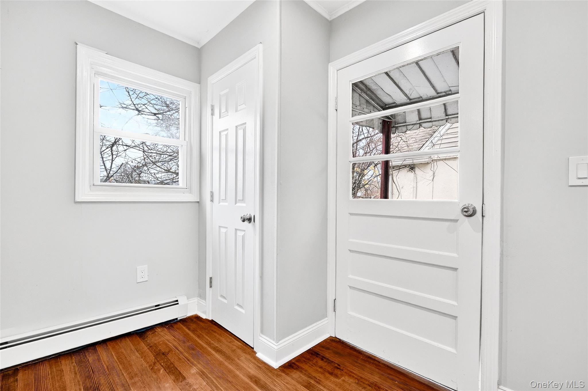 669 North Division Street Peekskill, NY 10566 - Photo 10 of 48 a view of room with hardwood floor and window