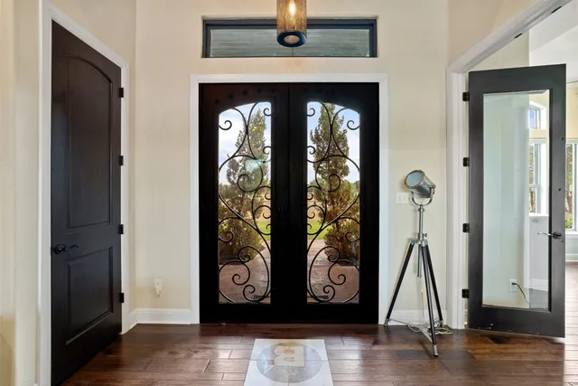 a view of front door with wooden floor