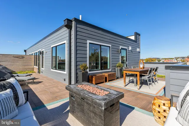 a backyard of a house with seating space