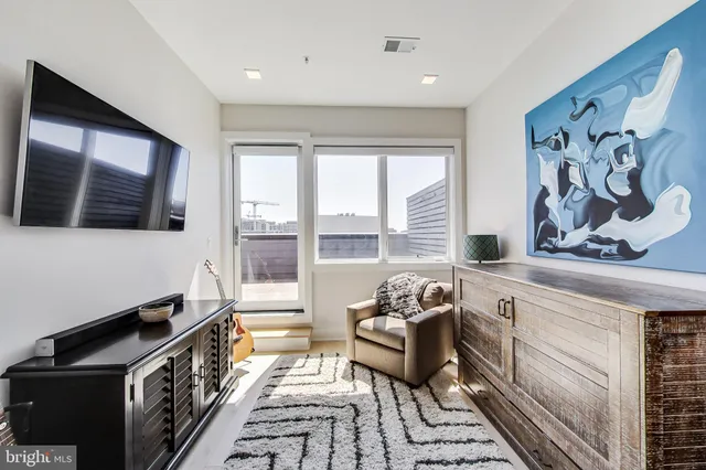 a kitchen with stainless steel appliances a stove and a large window