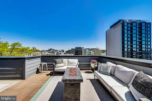 a view of a balcony with furniture