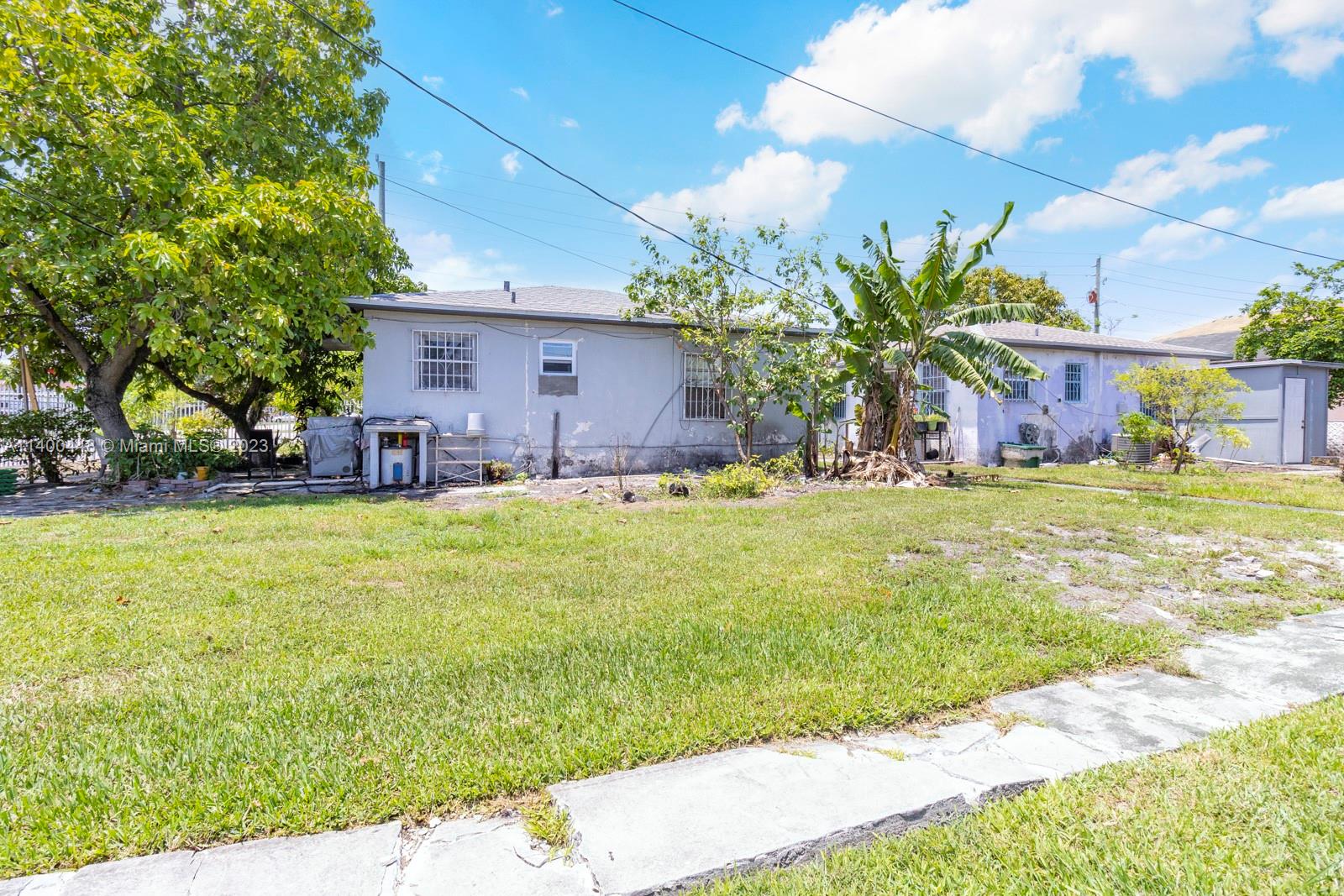 2990 Northwest 28th Street Miami, FL 33142 - Photo 6 of 13 a view of a house with a yard