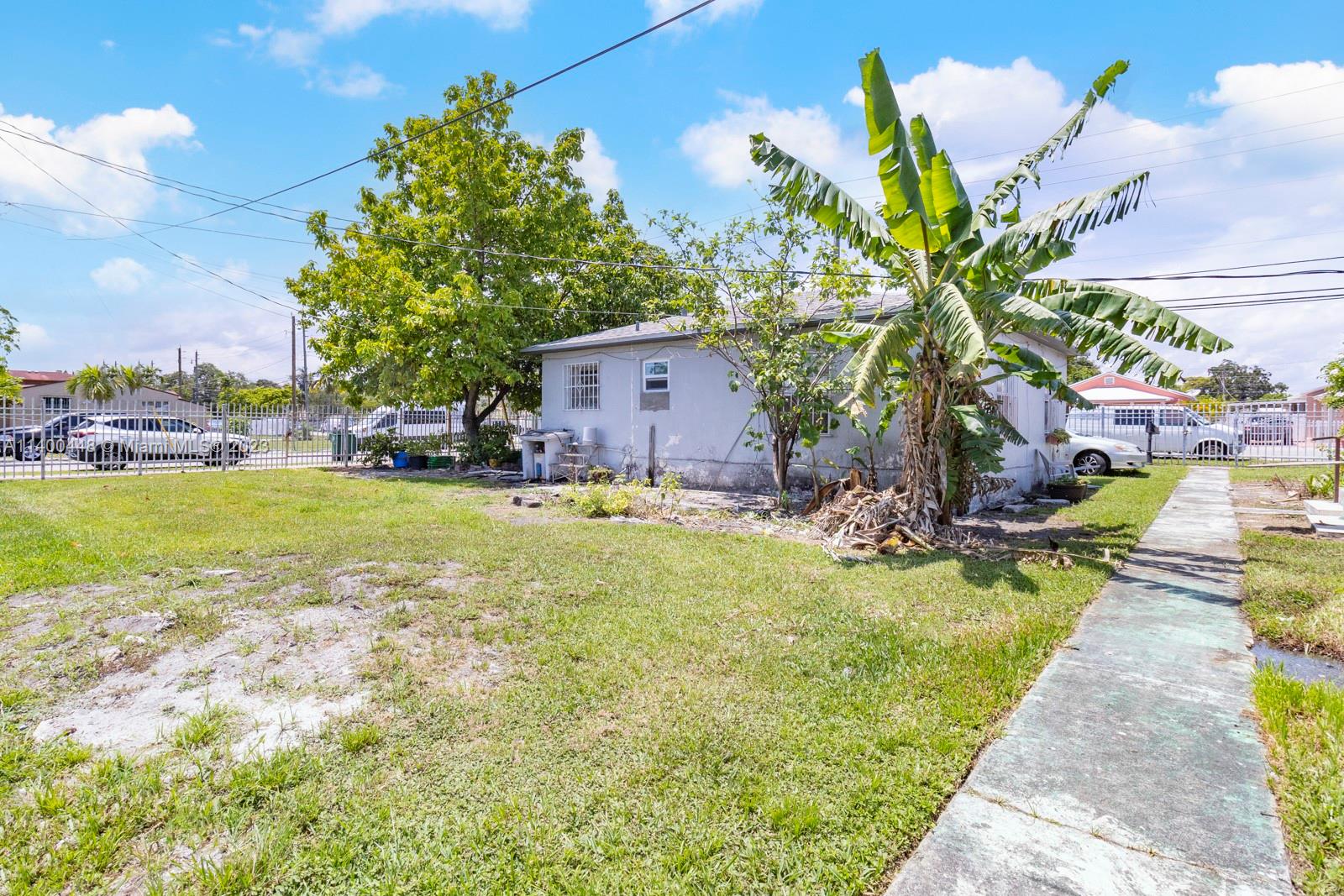 2990 Northwest 28th Street Miami, FL 33142 - Photo 7 of 13 a view of a swimming pool with a yard