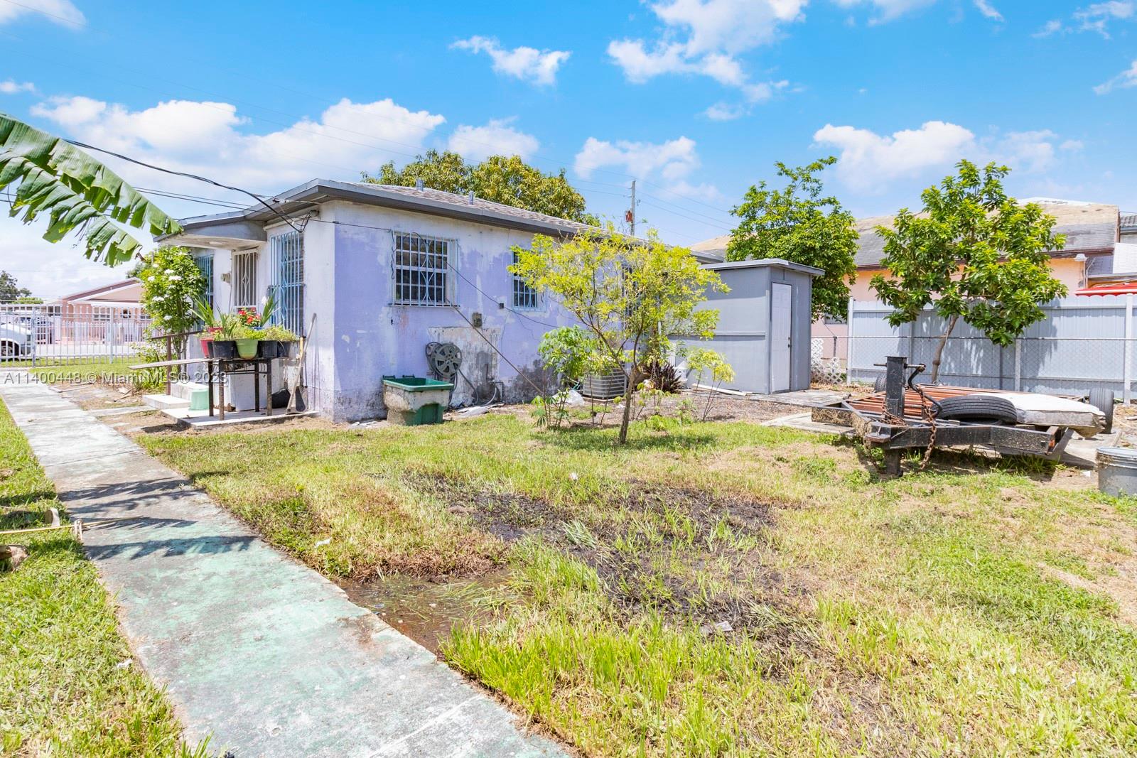 2990 Northwest 28th Street Miami, FL 33142 - Photo 8 of 13 a swimming pool with outdoor seating
