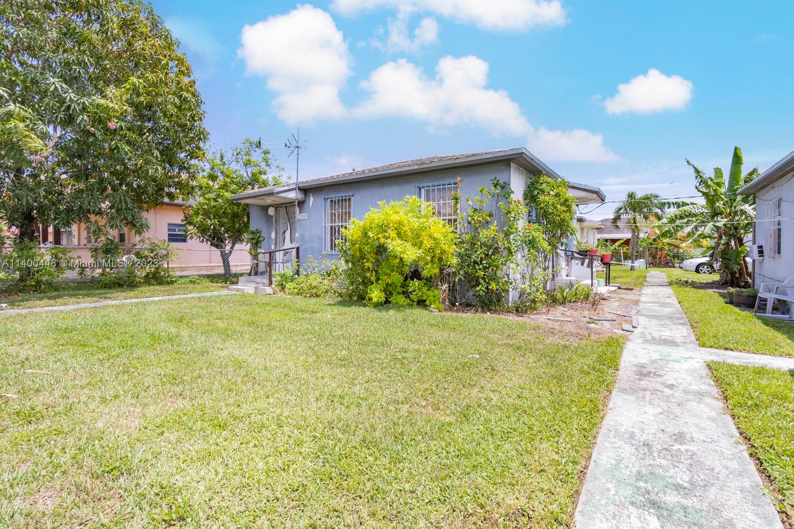 2990 Northwest 28th Street Miami, FL 33142 - Photo 9 of 13 a swimming pool with outdoor seating and yard