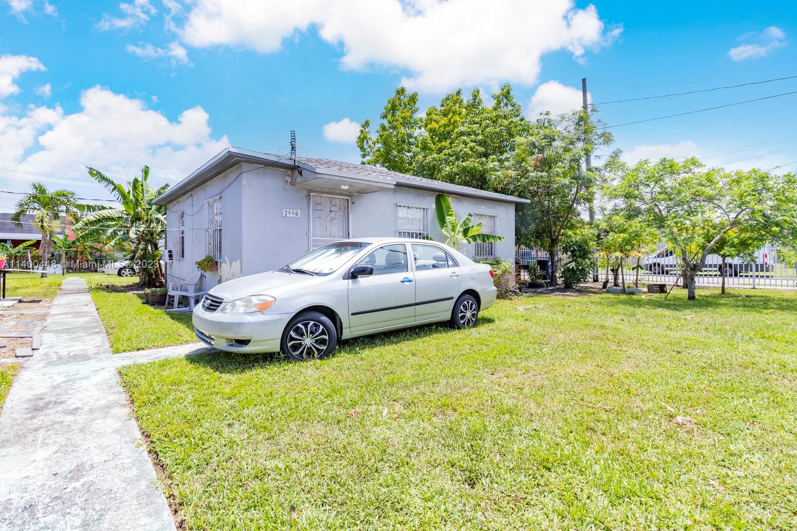 2990 Northwest 28th Street Miami, FL 33142 - Photo 10 of 13 a view of yard with car parked