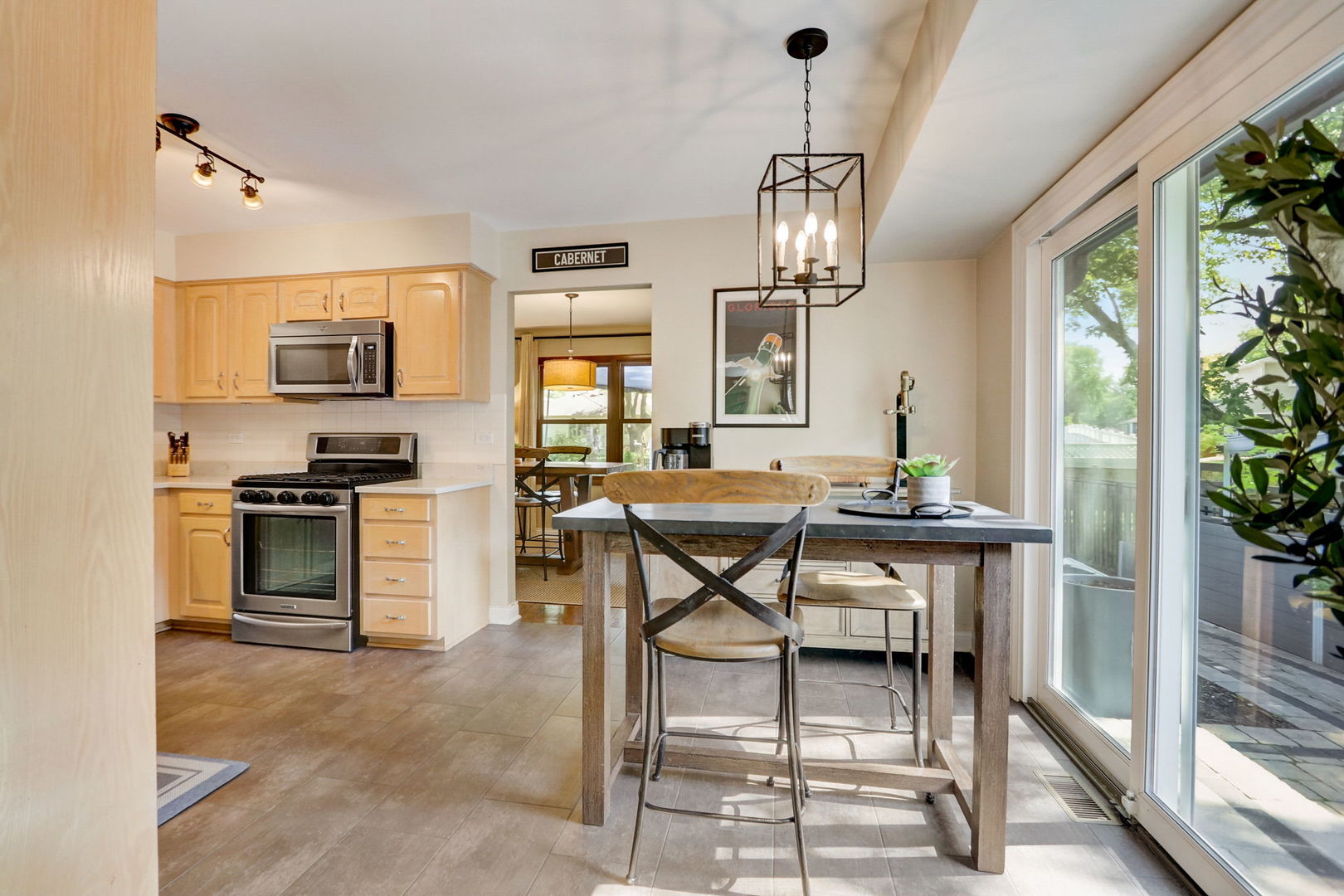 1514 Applegate Drive Naperville, IL 60565 - Photo 14 of 51 a view of a dining room with furniture window and wooden floor