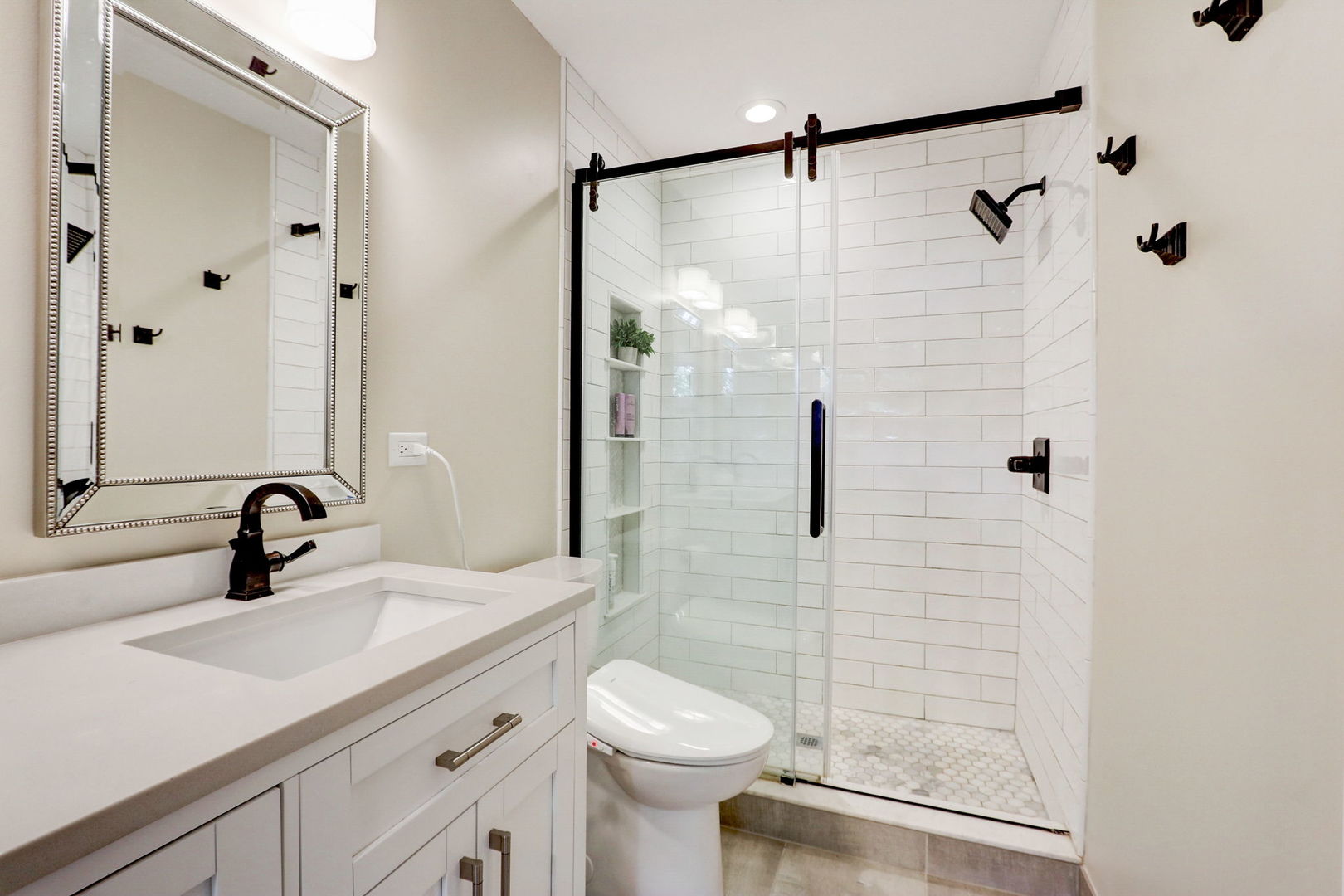 1514 Applegate Drive Naperville, IL 60565 - Photo 27 of 51 a bathroom with a sink toilet a mirror and shower