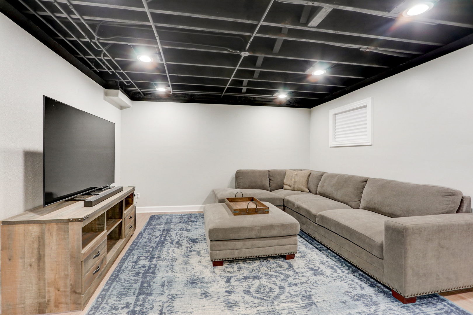 1514 Applegate Drive Naperville, IL 60565 - Photo 34 of 51 a living room with furniture and a flat screen tv