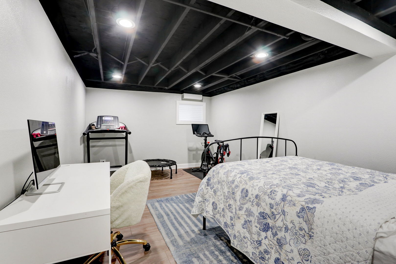 1514 Applegate Drive Naperville, IL 60565 - Photo 37 of 51 a bedroom with a bed a couch and a flat tv screen on the dresser