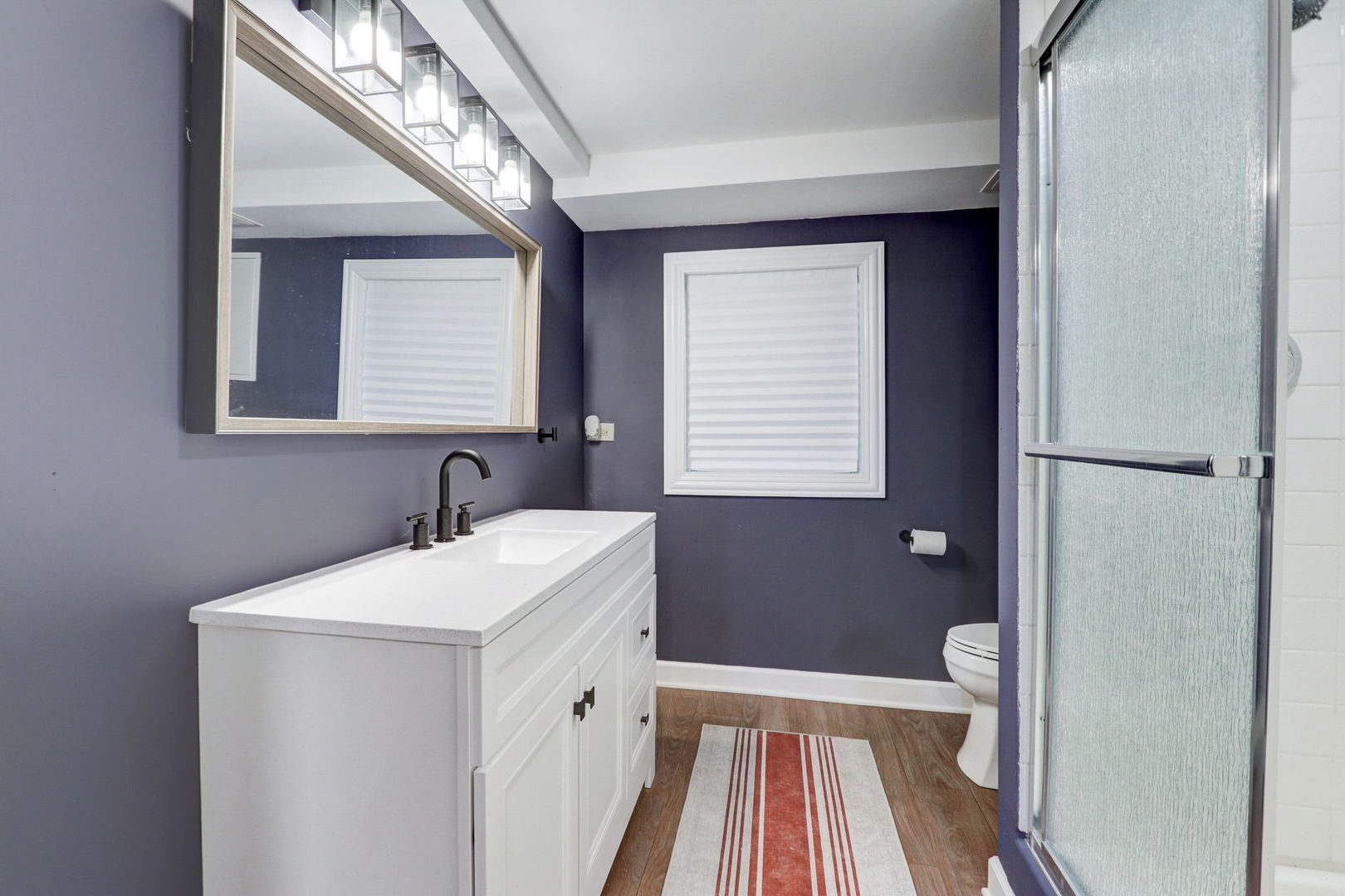 1514 Applegate Drive Naperville, IL 60565 - Photo 39 of 51 a bathroom with a sink and a mirror