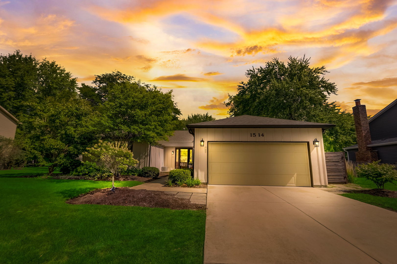1514 Applegate Drive Naperville, IL 60565 - Photo 4 of 51 a front view of a house with a yard and garage