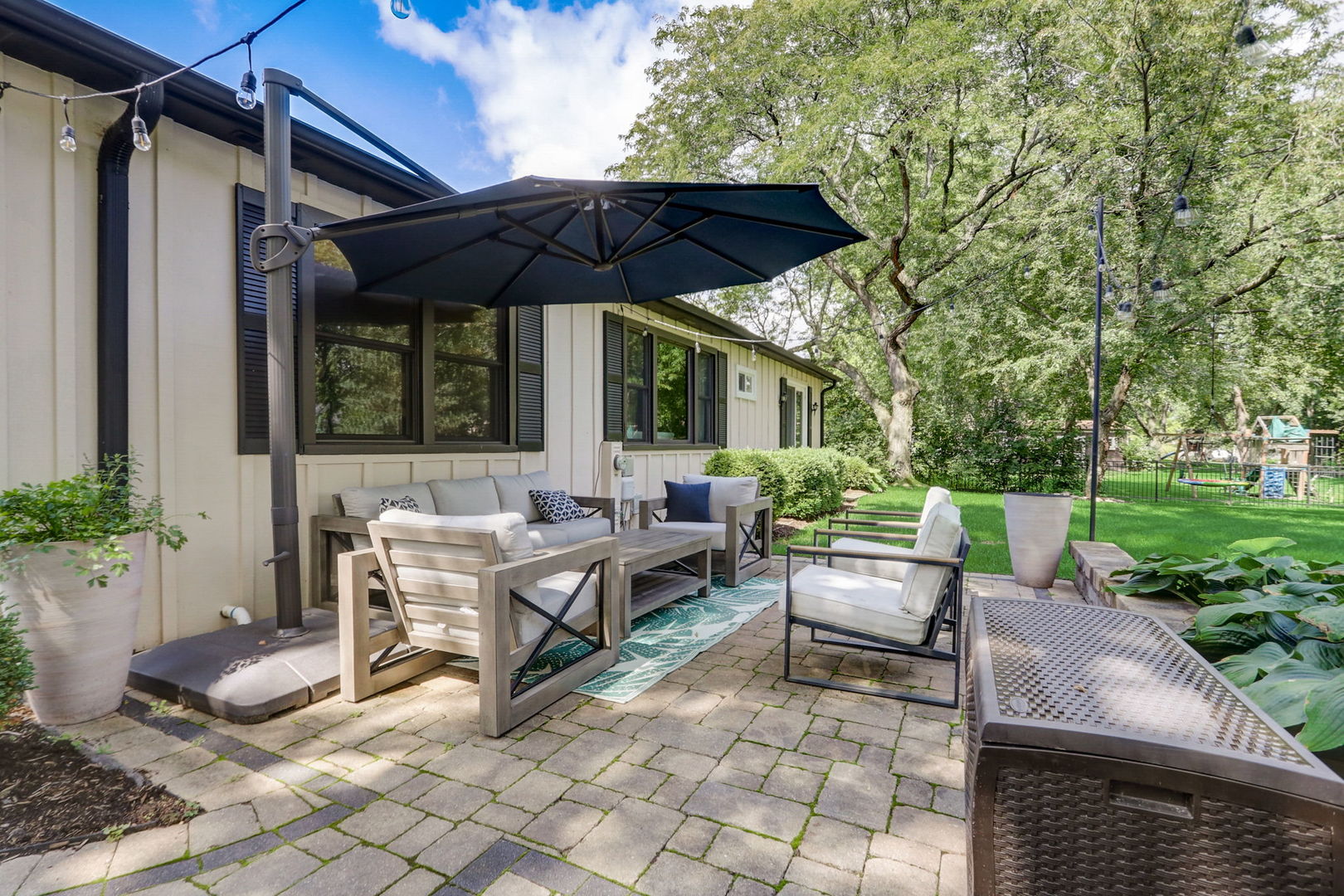 1514 Applegate Drive Naperville, IL 60565 - Photo 41 of 51 a view of patio with a table and chairs under an umbrella