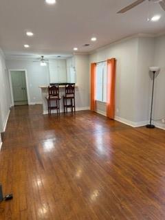 613 North Main Street Muenster, TX 76252 - Photo 5 of 24 a view of a room with wooden floor lounge chair and windows