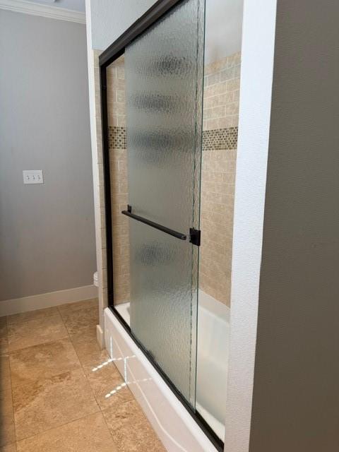613 North Main Street Muenster, TX 76252 - Photo 7 of 24 a bathroom with a glass shower door and a glass door
