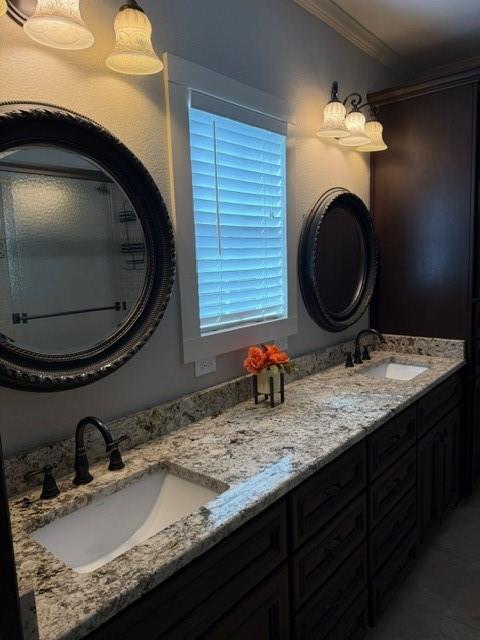 613 North Main Street Muenster, TX 76252 - Photo 8 of 24 a bathroom with a granite countertop sink a mirror and toilet
