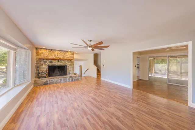 a view of empty room with a fireplace