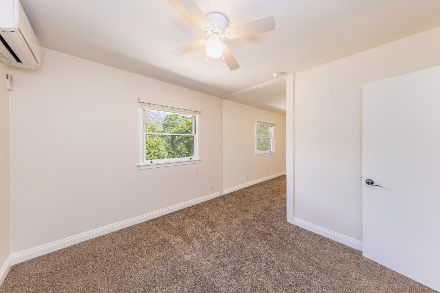 1073 Shippee Lane Ojai, CA 93023 - Photo 20 of 28 an empty room with windows and a ceiling fan