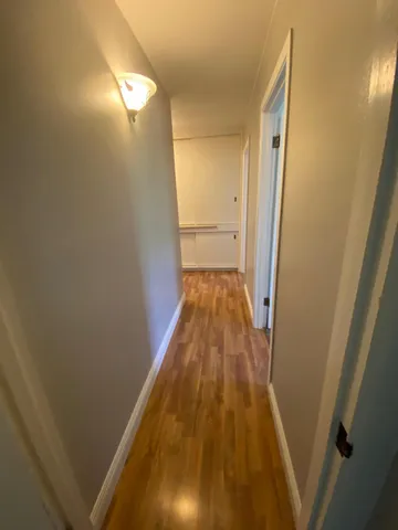 a bathroom with a sink a toilet and a window