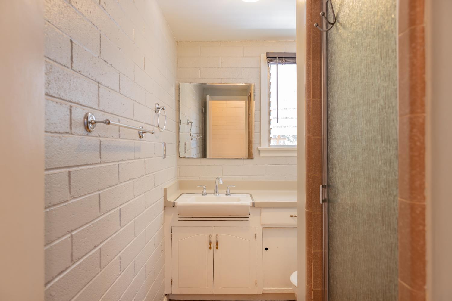 1073 Shippee Lane Ojai, CA 93023 - Photo 25 of 28 a bathroom with a sink a toilet and mirror