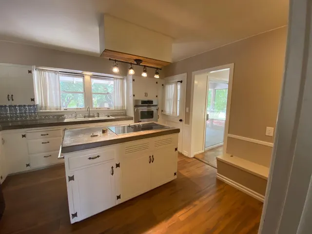 a bathroom with a sink and a window