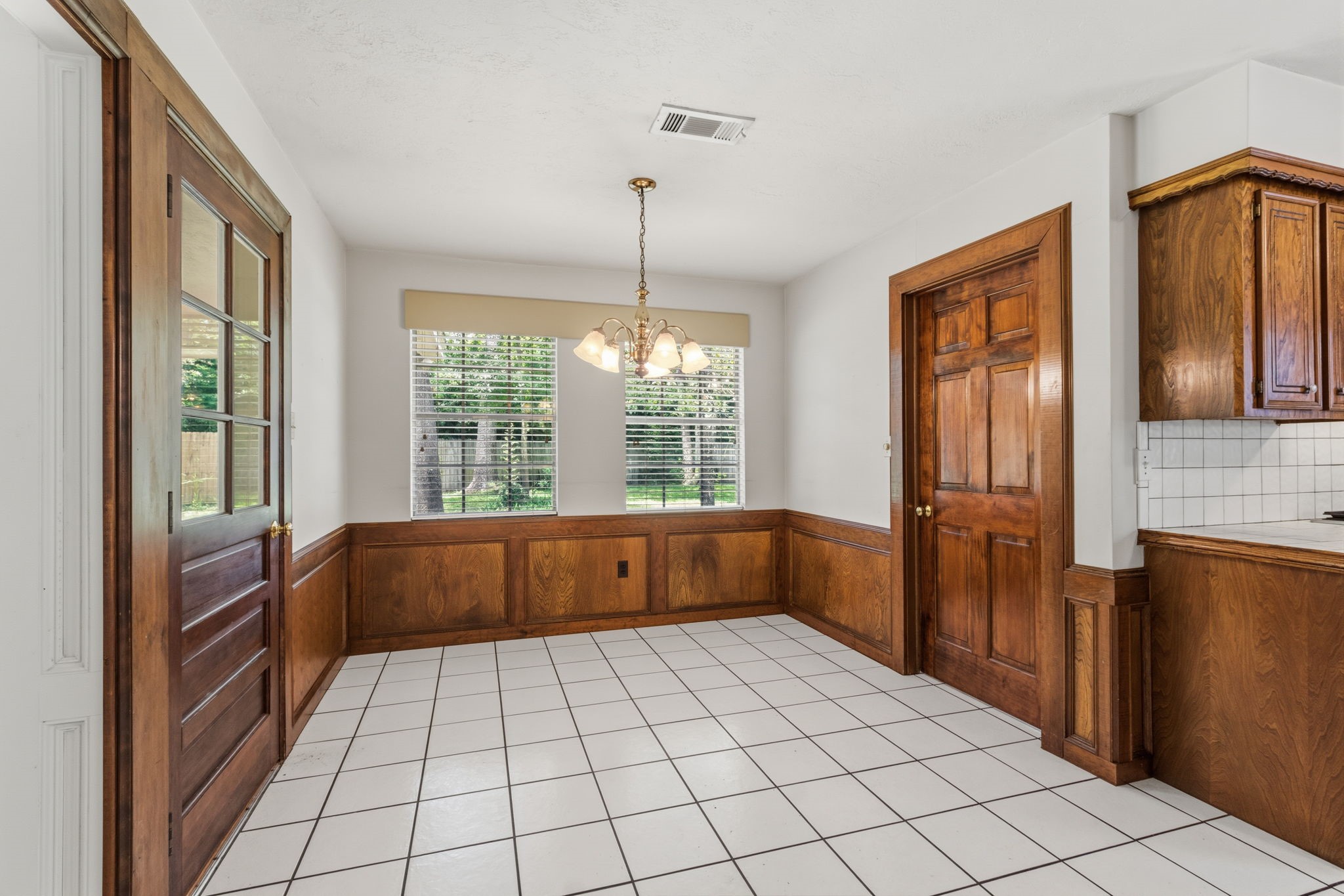 3422 Candlewisp Drive Spring, TX 77388 - Photo 15 of 50 BREAKFAST ROOM - Enjoy pretty views of the back yard while sitting in the breakfast room. Utility room is to the right.