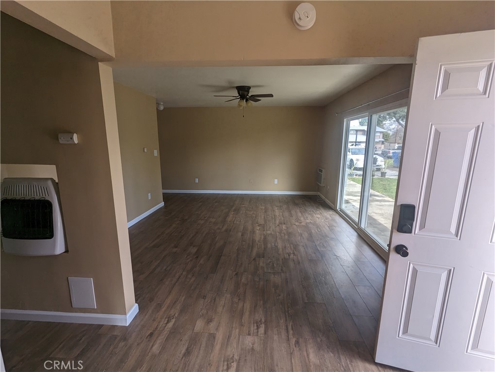9330-9332 Saffron Court Riverside, CA 92503 - Photo 12 of 21 wooden floor in an empty room with a window