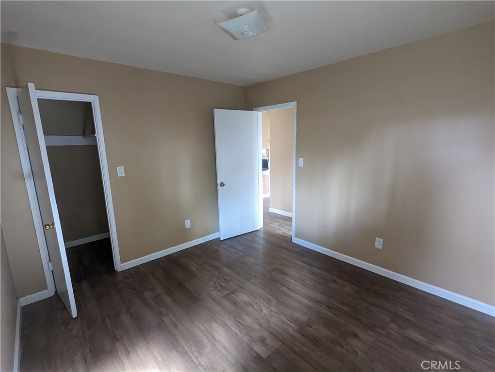 9330-9332 Saffron Court Riverside, CA 92503 - Photo 21 of 21 an empty room with wooden floor and entrance