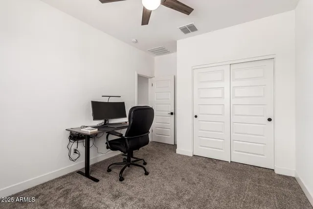 an empty room with closet and bathroom