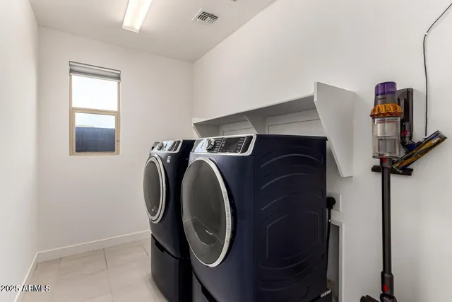 an aerial view of a house with a swimming pool patio and outdoor seating