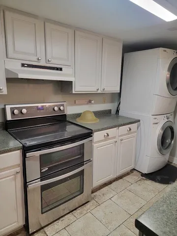 a kitchen with a stove and a microwave