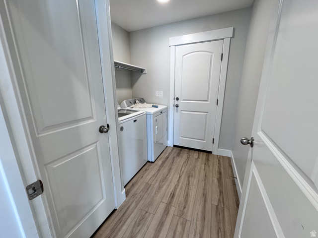 12339 Remy Road, Unit 422 Herriman, UT 84096 - Photo 17 of 36 Laundry area featuring separate washer and dryer and light wood finished floors