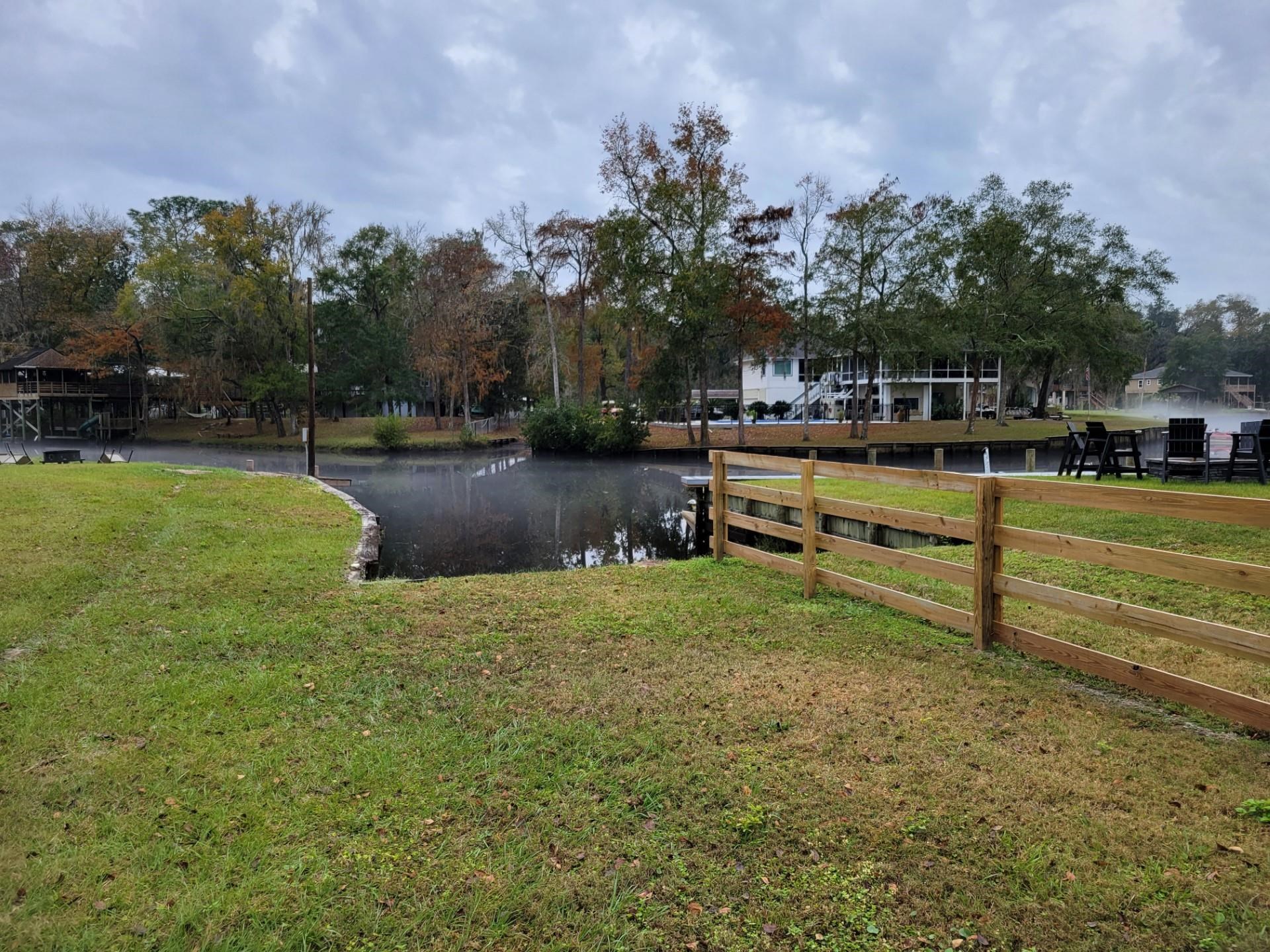 4057 Lazy Acres Road Middleburg, FL 32068 - Photo 11 of 15 a view of a swimming pool with a table and chairs