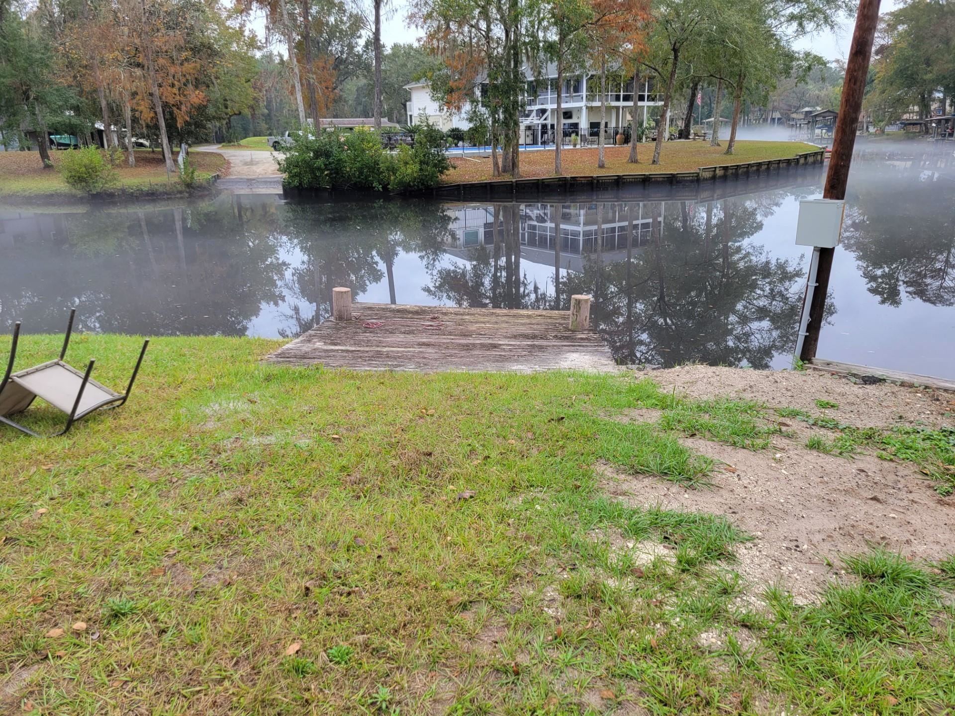 4057 Lazy Acres Road Middleburg, FL 32068 - Photo 12 of 15 a view of a lake with a house in the background