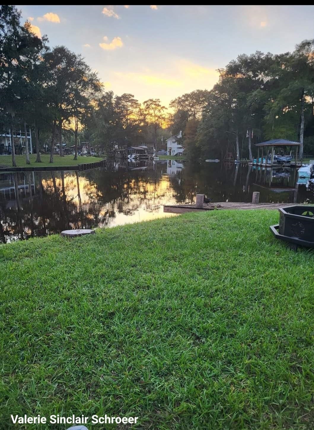 4057 Lazy Acres Road Middleburg, FL 32068 - Photo 14 of 15 a view of a green field with wooden fence