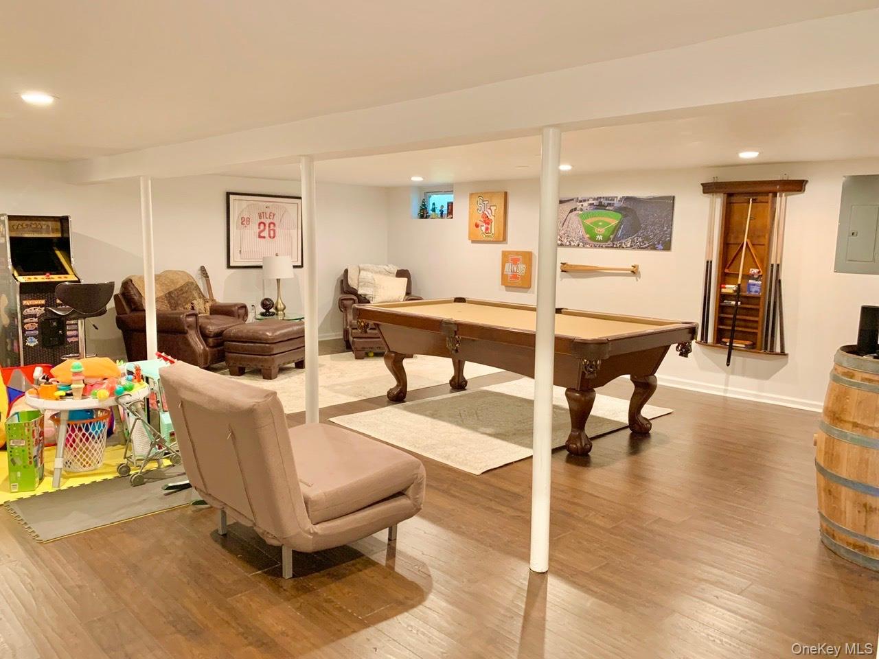 61 Kings Point Road East Hampton, NY 11937 - Photo 11 of 15 Playroom with recessed lighting, light wood-style flooring, billiards, and electric panel