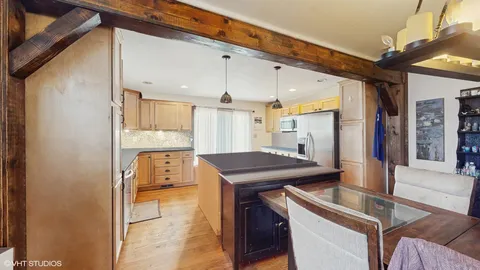a kitchen with a stove and a refrigerator