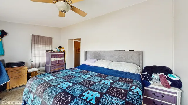 a bedroom with a bed and dresser