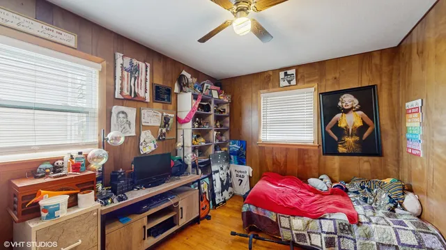 a bedroom with furniture and a window