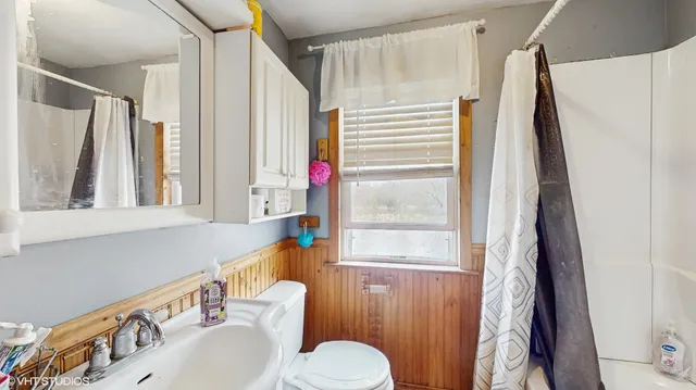 a living room with lots of furniture and a chandelier