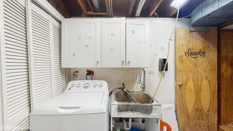 a view of a deck with chairs and wooden fence