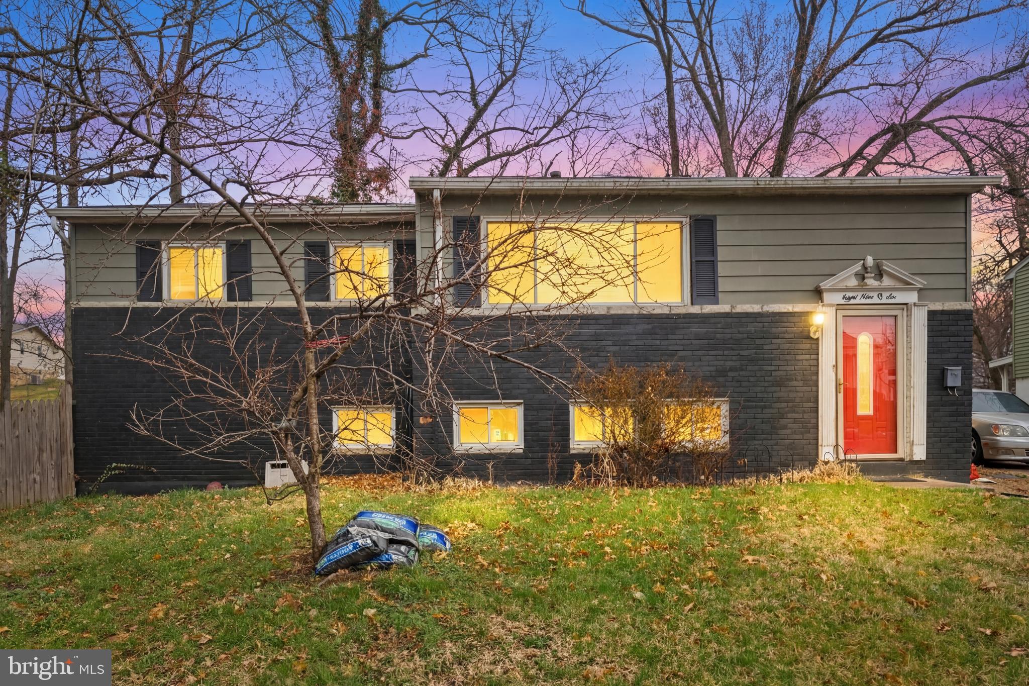 8906 Scheurer Street Lanham, MD 20706 - Photo 2 of 21 a view of a house with a yard